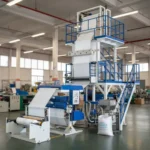 نمای کامل دستگاه اکسترودر فیلم دمشی نایلون و نایلکس در حال کار در یک کارگاه صنعتی.